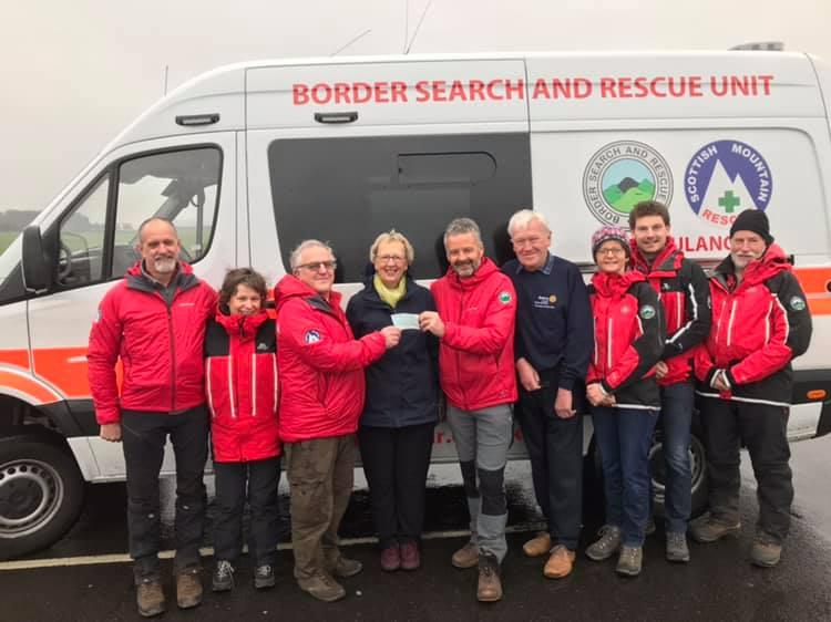 Team Chairman and Team Leader receive cheque from President Liz